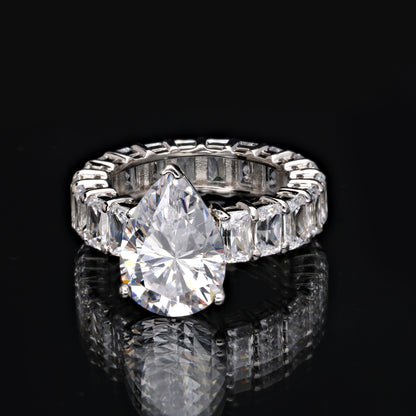 A FULL ETERNITY RING WITH A DROPLET SOLITAIRE