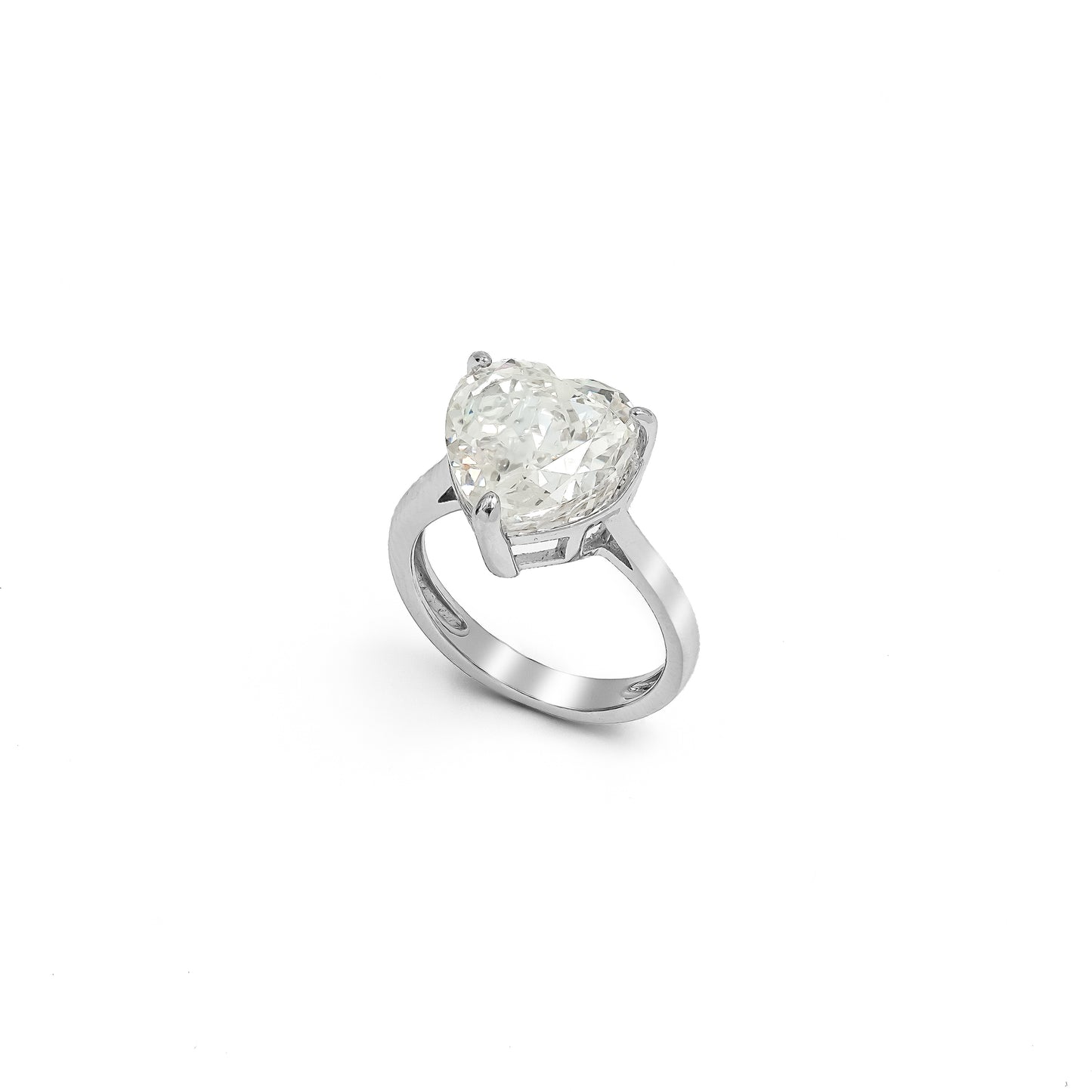 A MINIMALIST HEART-SHAPED SOLITAIRE RING.